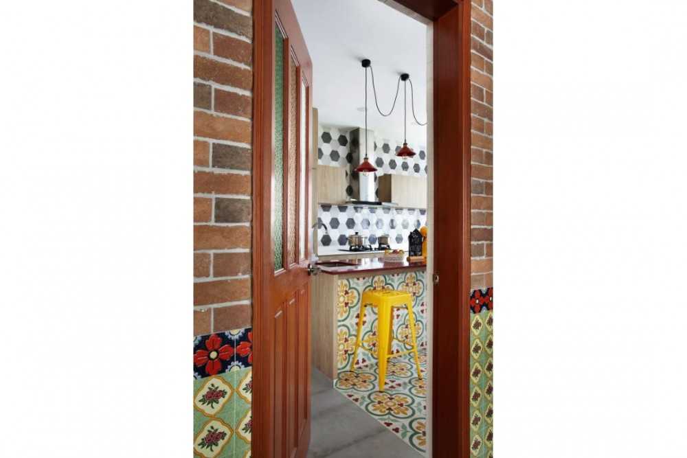 Eclectic Kitchen with Bar Counter and Doors