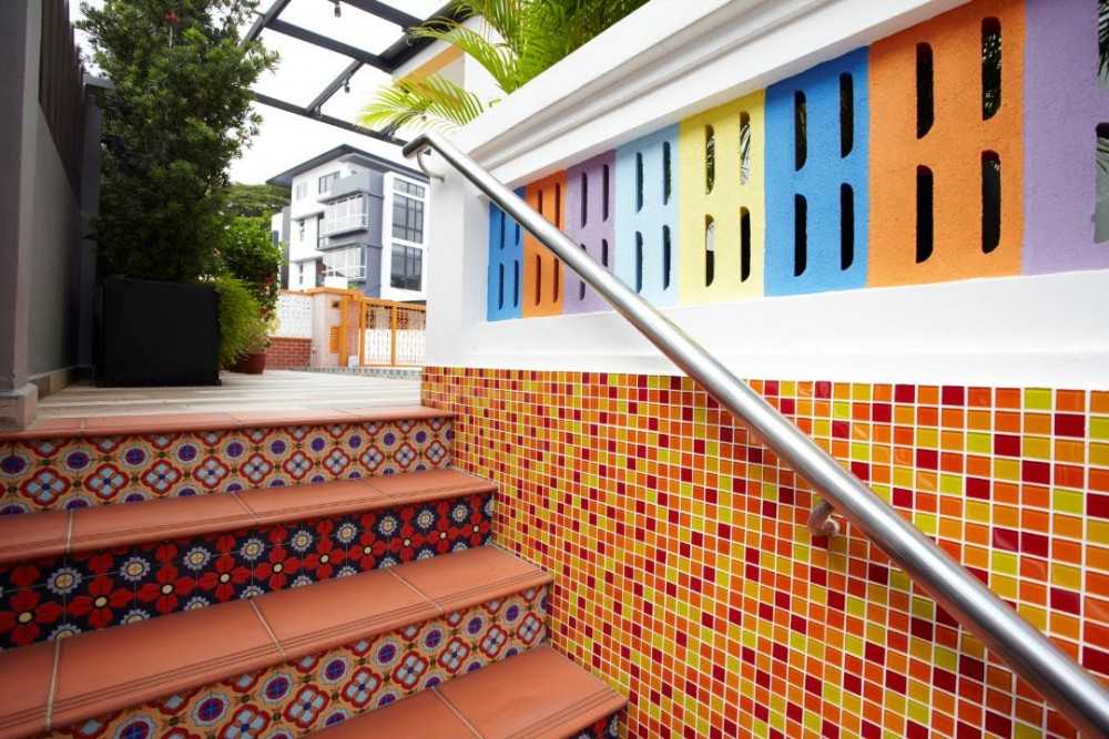 Eclectic Entryway with Feature Wall and Staircase