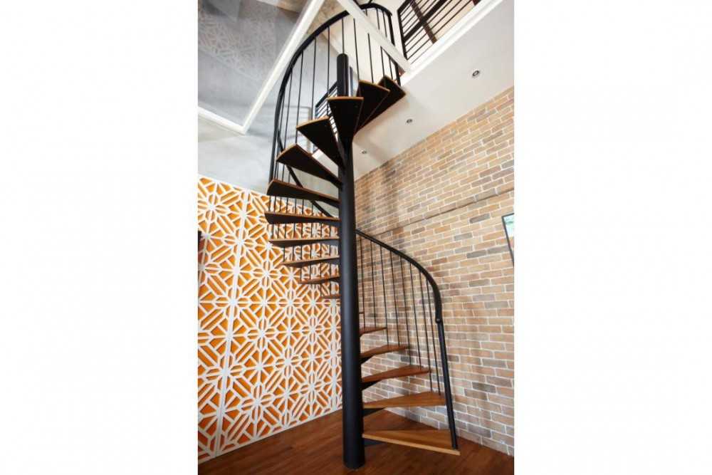 Eclectic Hallway with Feature Wall and Staircase