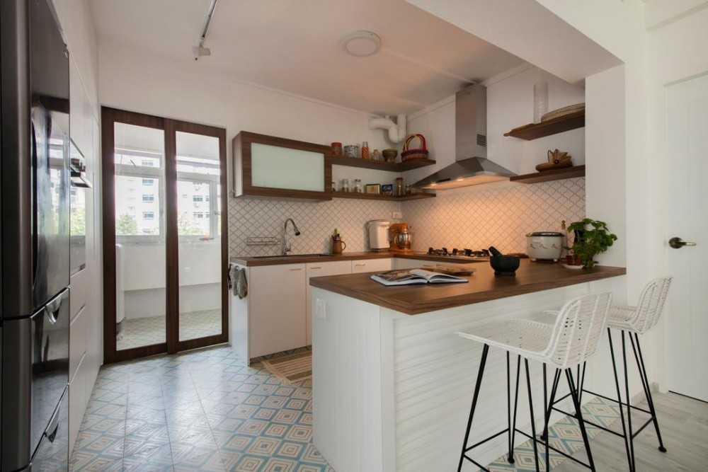 Eclectic Kitchen with Herringbone Tiling and Bar Counter