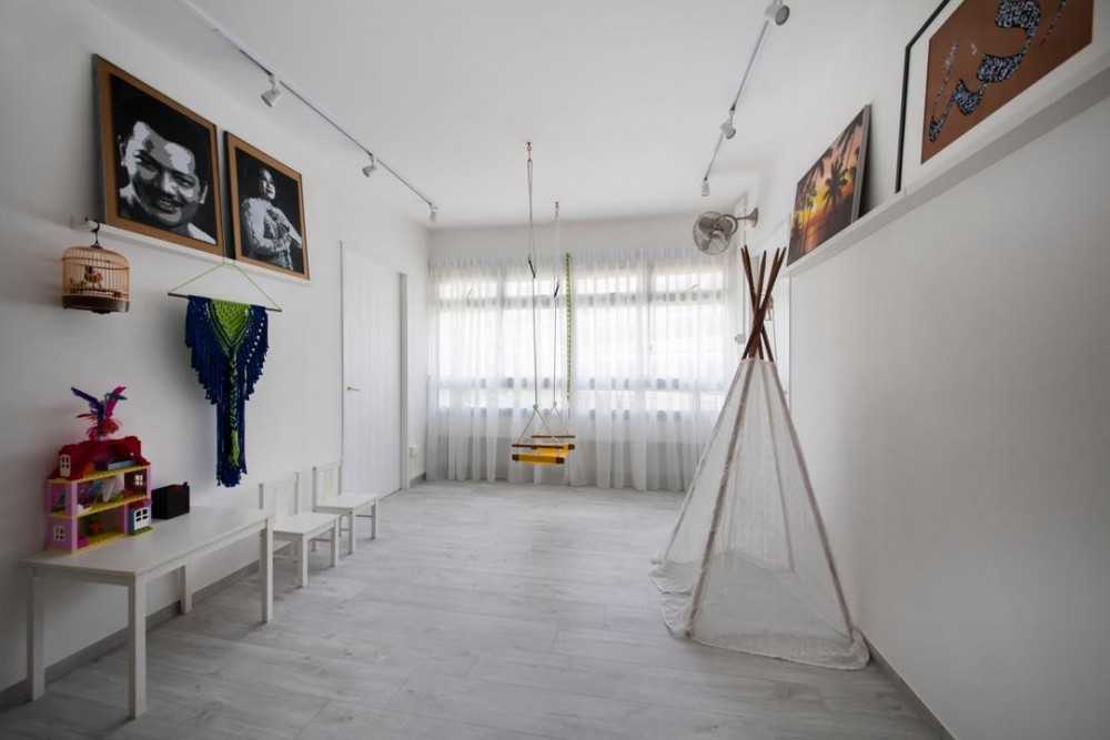 Eclectic Kids Room with Paintings and Toys