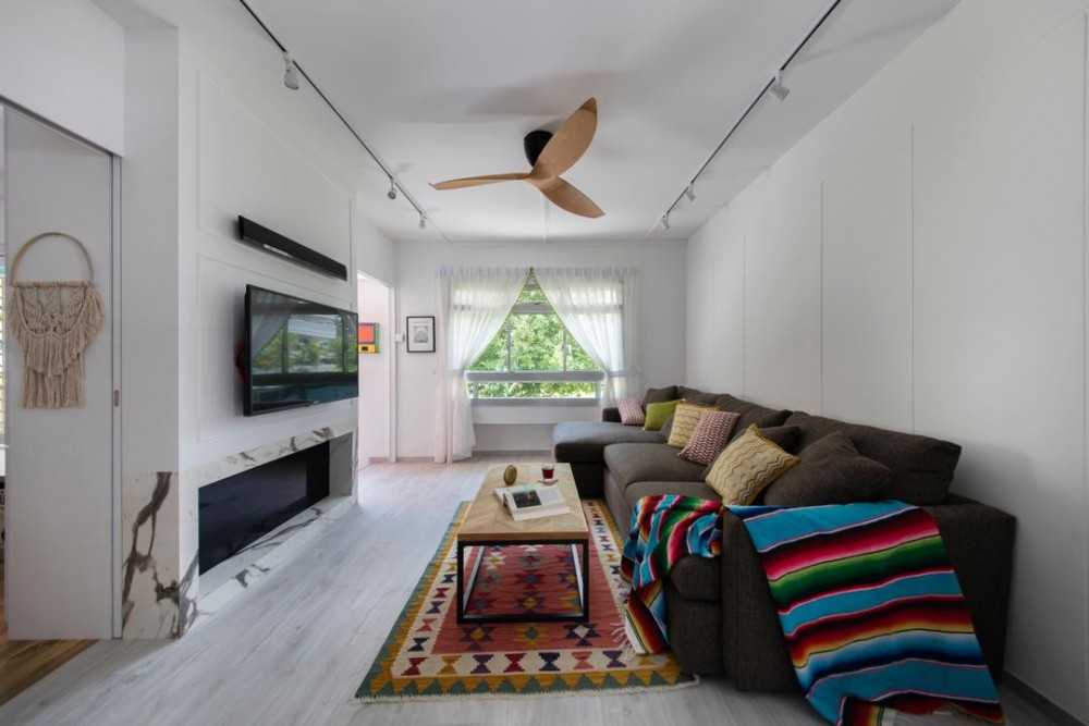 Eclectic Living Room with Feature Wall and Sofa