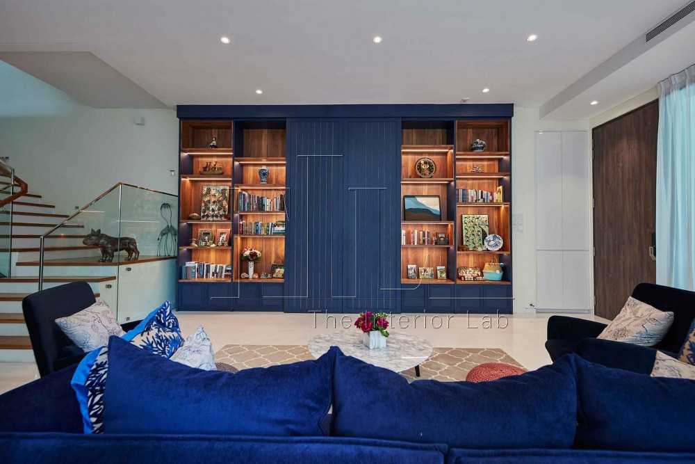 Modern Living Room with Bookshelf and Armchairs