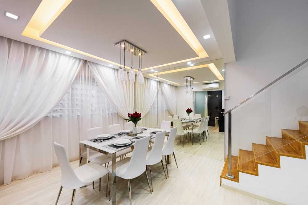 Modern Dining Room with Drop Light and Mirror
