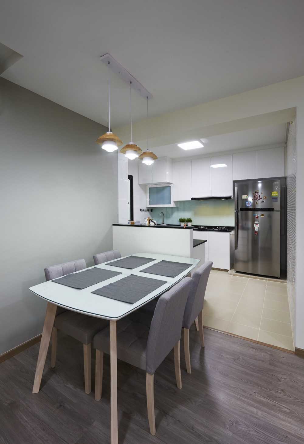 Scandinavian Dining Room with Wood Flooring and Drop Light