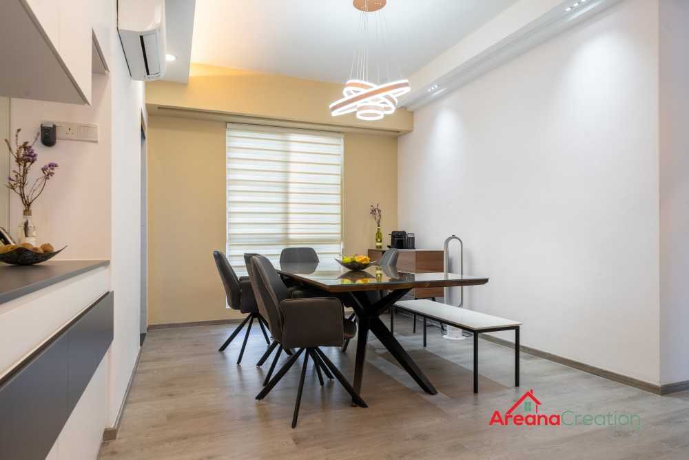 Contemporary Dining Room with Drop Light and Downlights