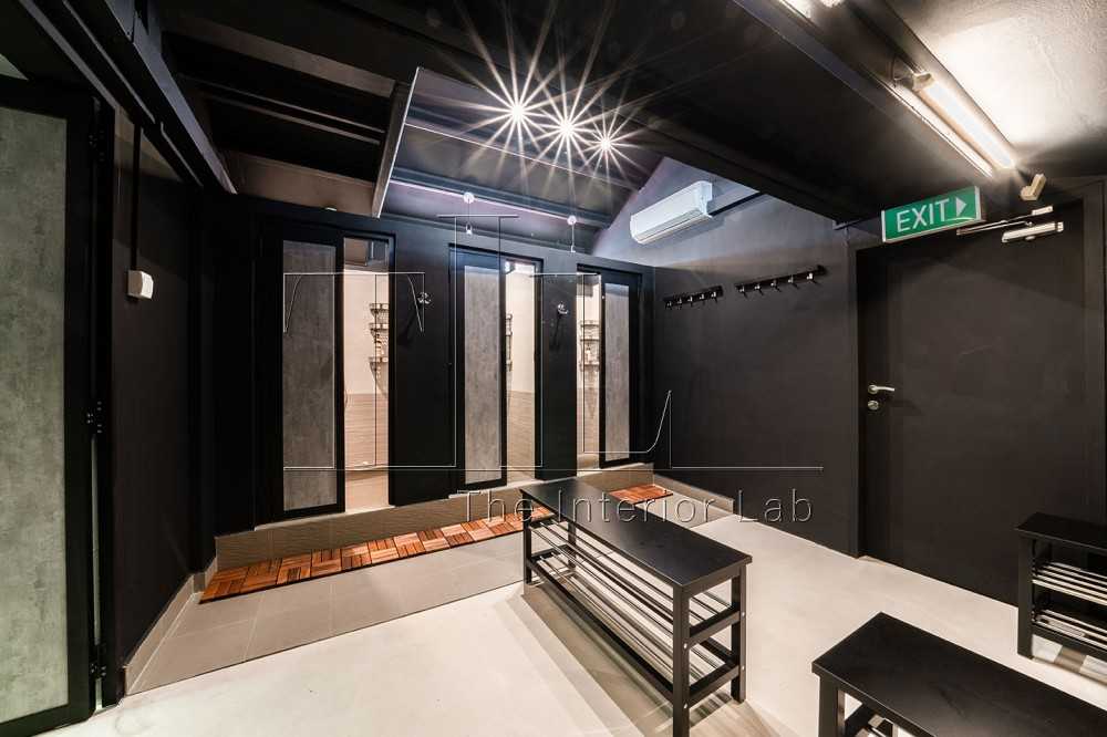 Industrial Bathroom with Metal Gate and Showers