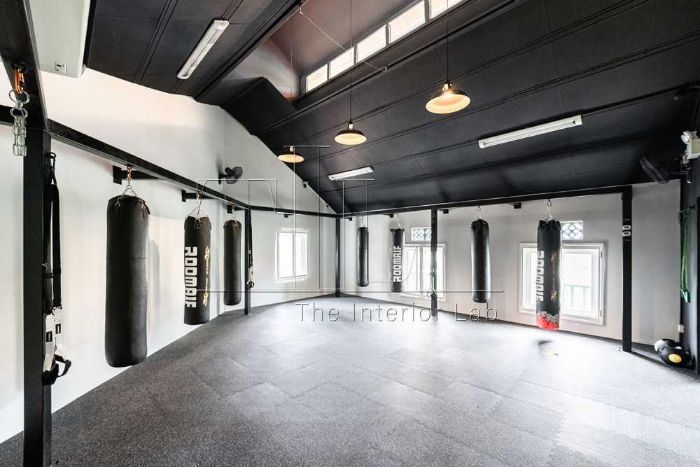 Industrial Studio with Metal Gate and Gym Equipment