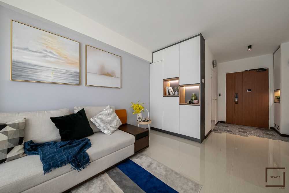 Minimalist Living Room with Bookshelf and Granite Floor