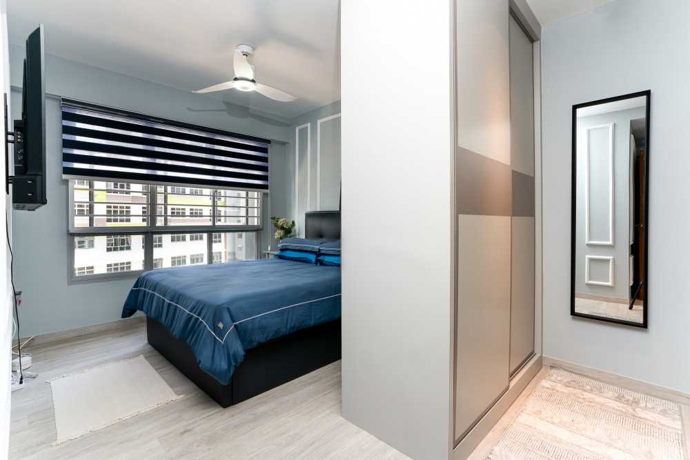 Transitional Bedroom with Wood Flooring and Mirror