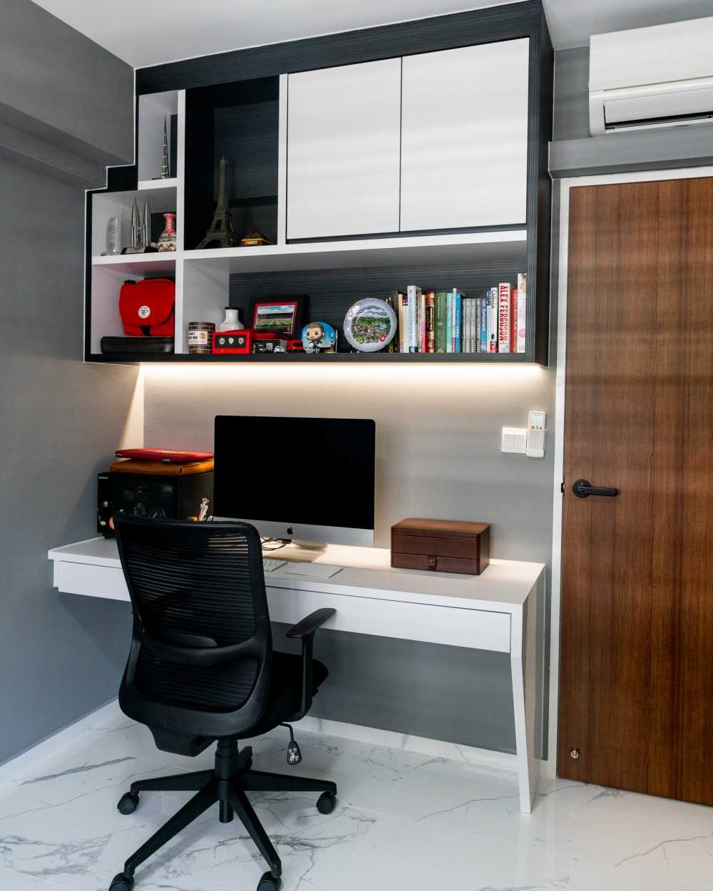 Contemporary Home Office with Bookshelf and Desk Chairs