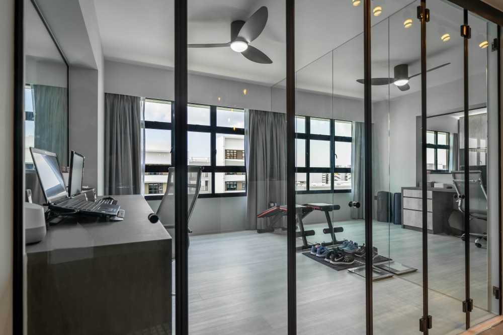 Contemporary Home Office with Mirror and Glass Door