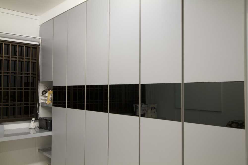 Modern Bedroom with Bookshelf and Homogeneous Tiles