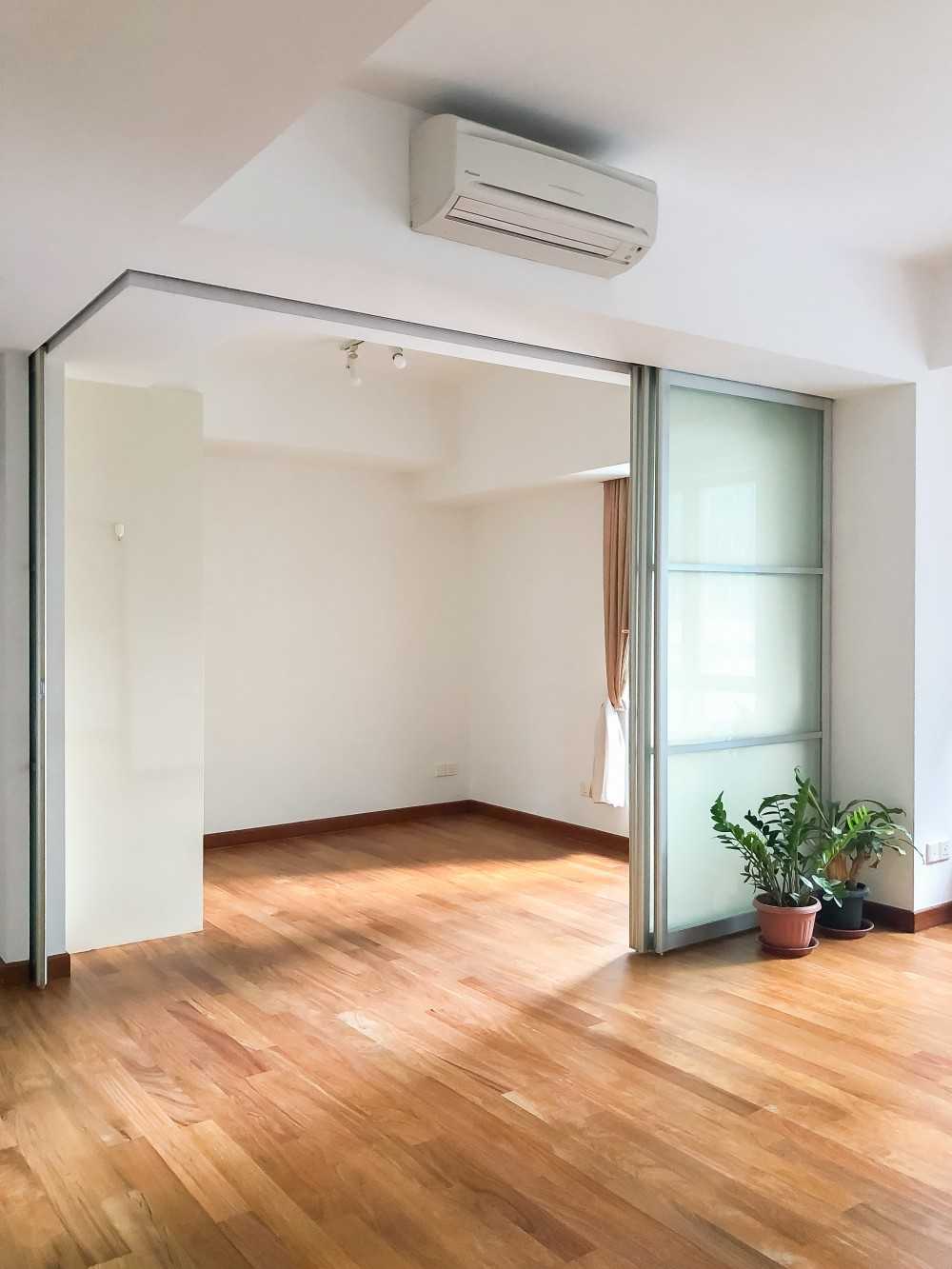 Minimalist Bedroom with Parquet Floor and Paintings
