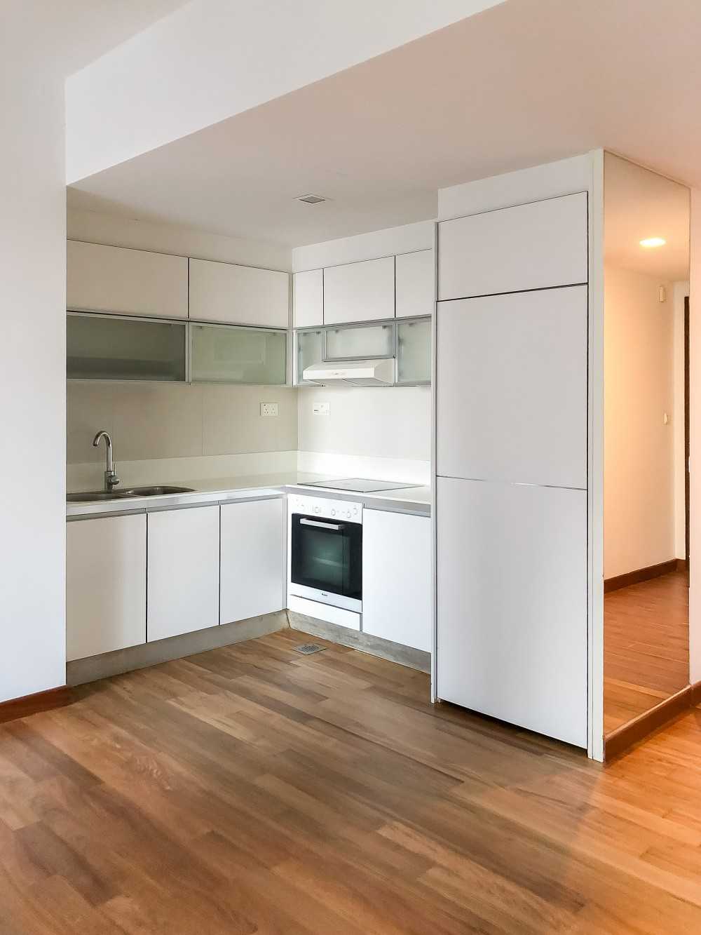 Minimalist Kitchen with Parquet Floor and Paintings