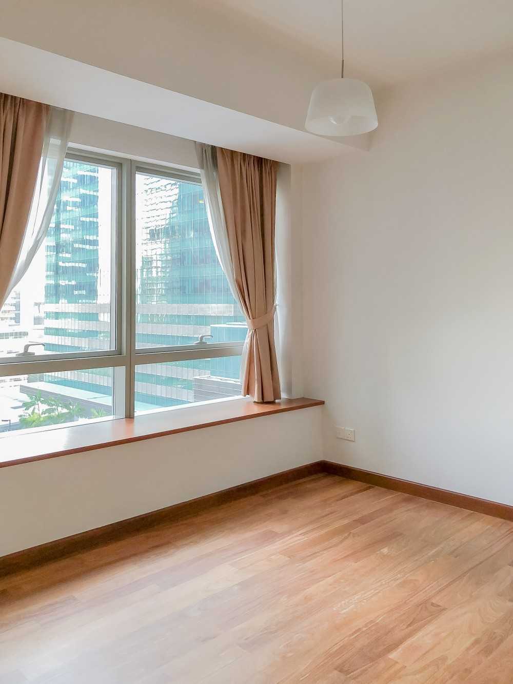 Minimalist Bedroom with Parquet Floor and Paintings