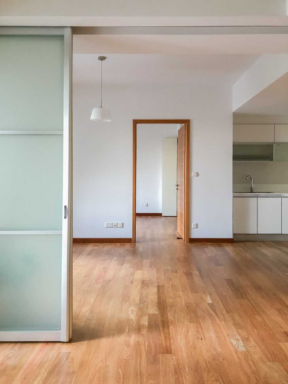Minimalist Bedroom with Parquet Floor and Paintings