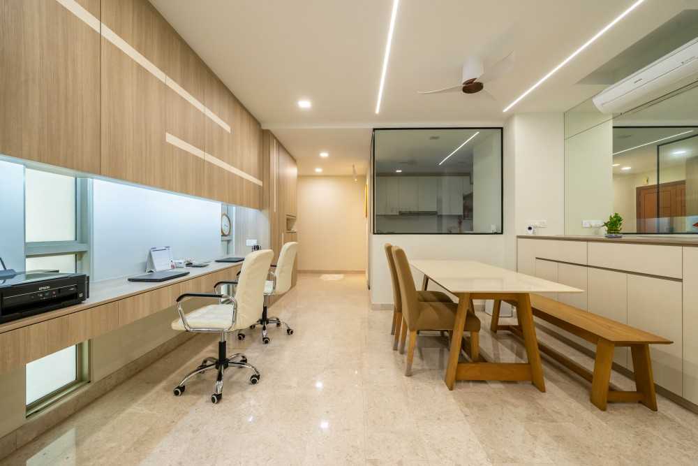 Contemporary Home Office with Bookshelf and Desk Chairs