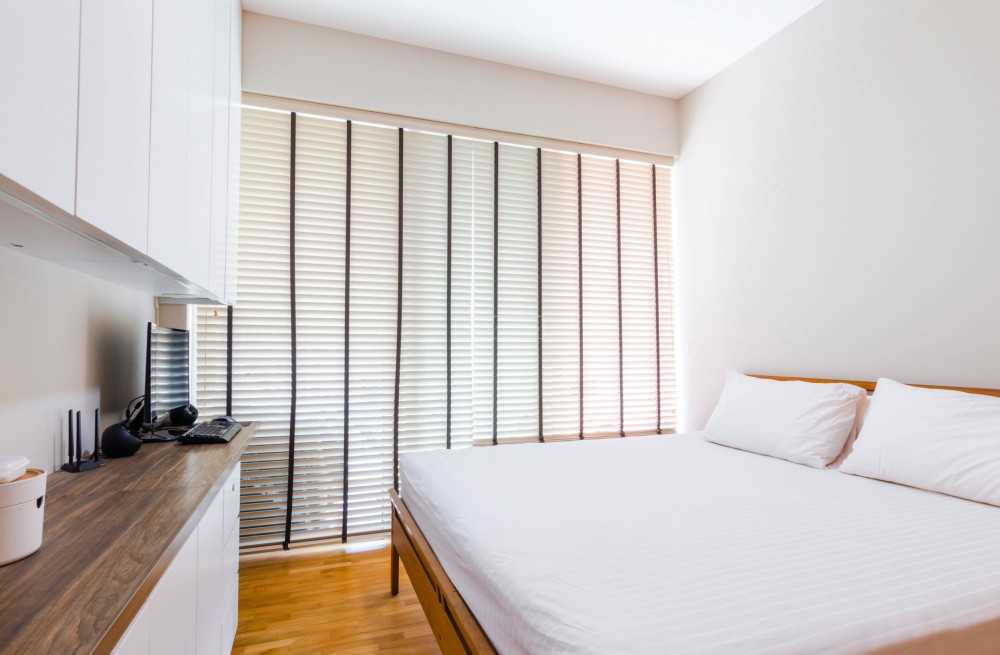 Modern Bedroom with Bookshelf and Parquet Floor