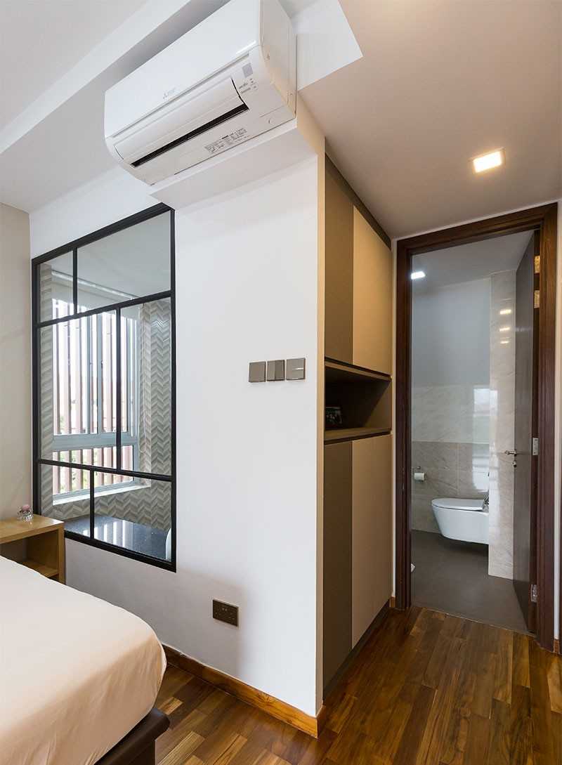 Modern Bedroom with Parquet Floor and Ceiling Light