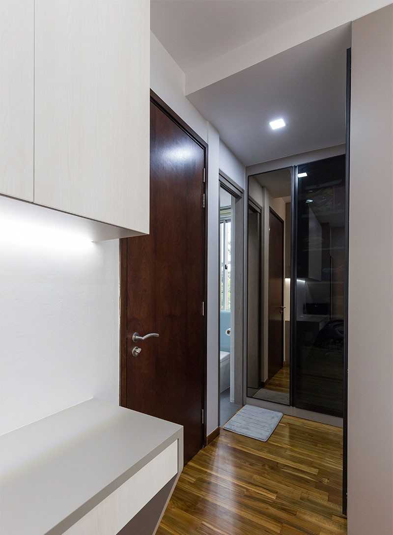 Modern Entryway with Mirror and Rugs