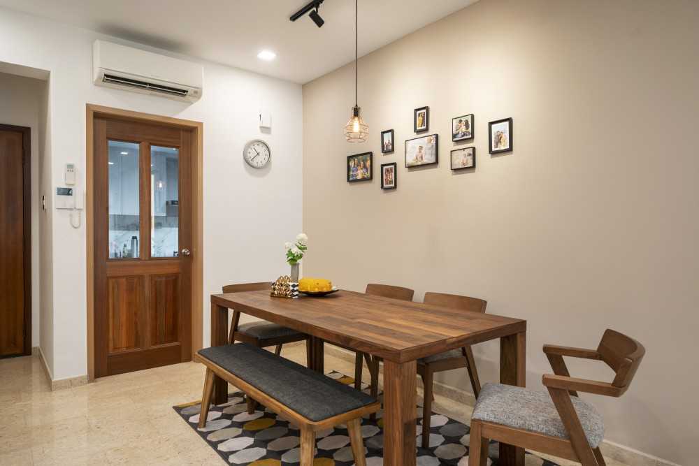 Minimalist Dining Room with Drop Light and Dining Table