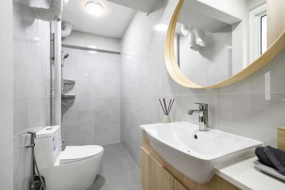Scandinavian Bathroom with Homogeneous Tiles and Mirror