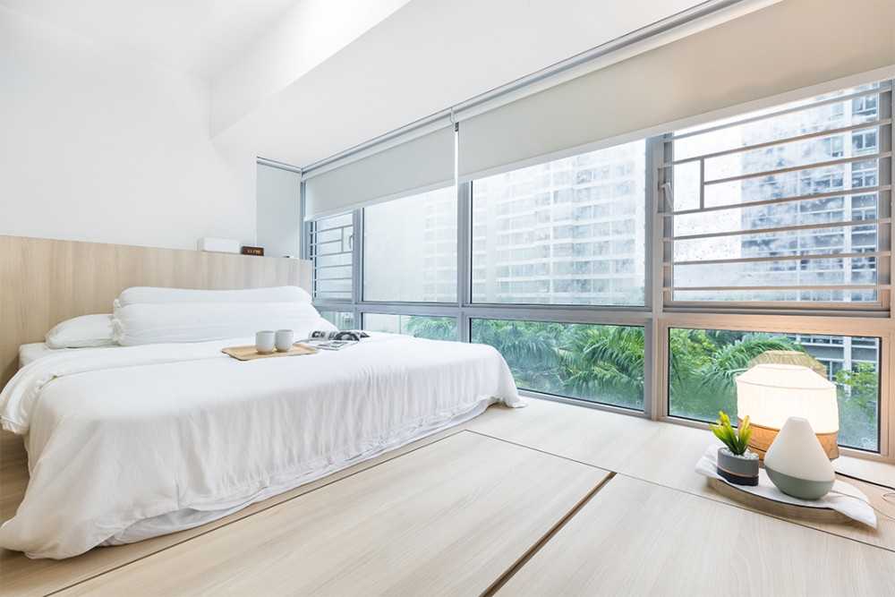 Asian Bedroom with Platform Bed and Wood Flooring