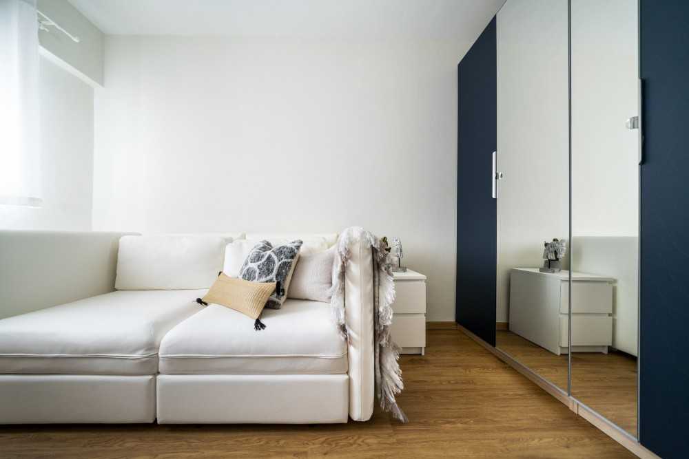 Modern Bedroom with Homogeneous Tiles and Wood Flooring