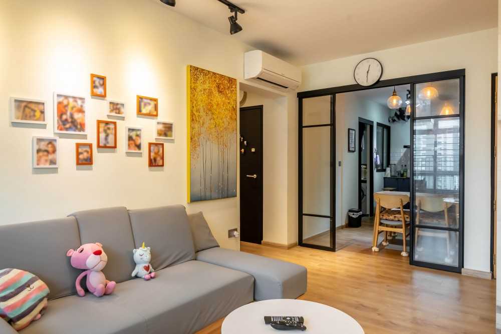 Scandinavian Living Room with Wood Flooring and Sofa