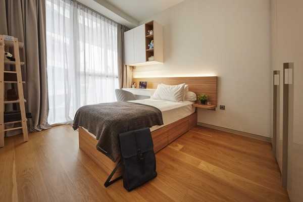 Scandinavian Bedroom with Wood Flooring and Wardrobe