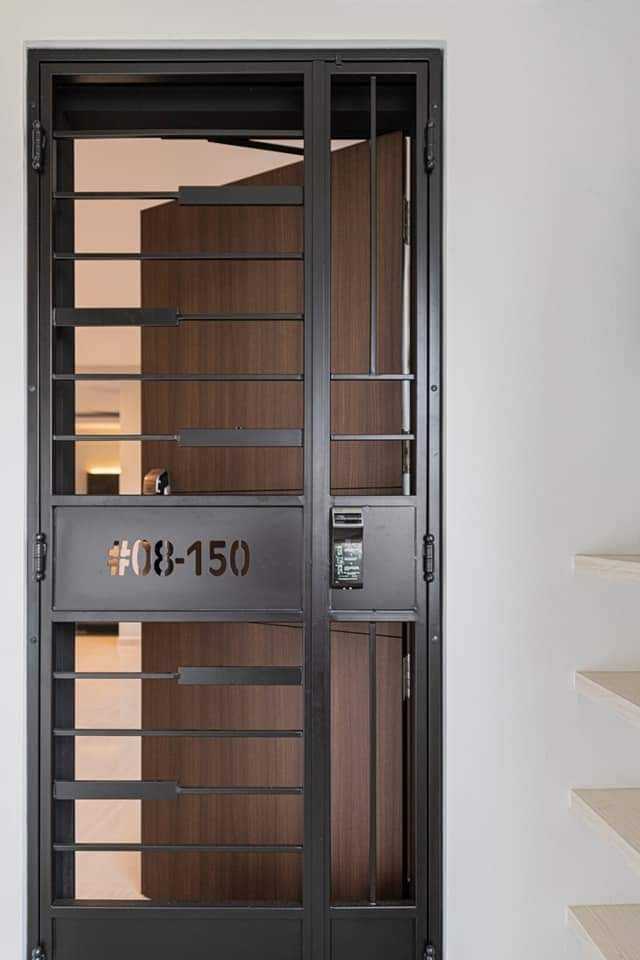Contemporary Foyer with Metal Gate and Doors