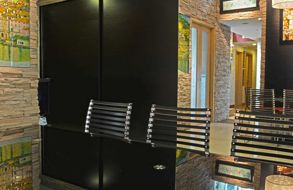 Asian Dining Room with Feature Wall and Drop Light