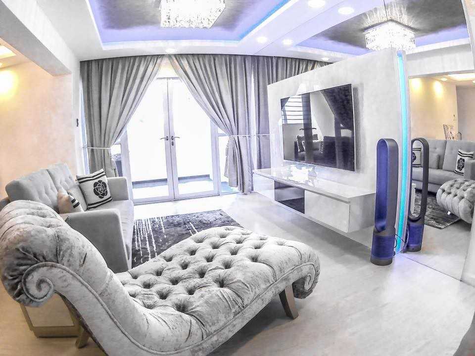 Modern Living Room with Vinyl Flooring and Feature Wall
