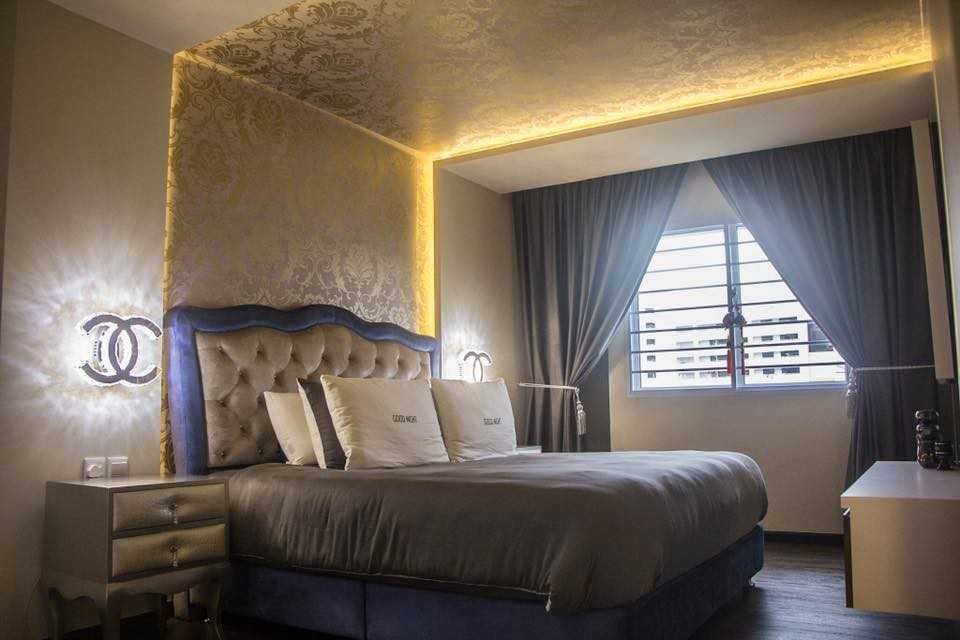 Modern Bedroom with Vinyl Flooring and Cove Lighting