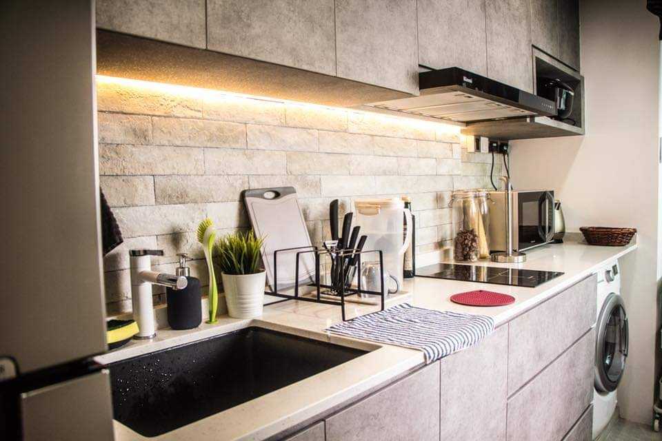 Industrial Kitchen with Countertop and Homogeneous Tiles