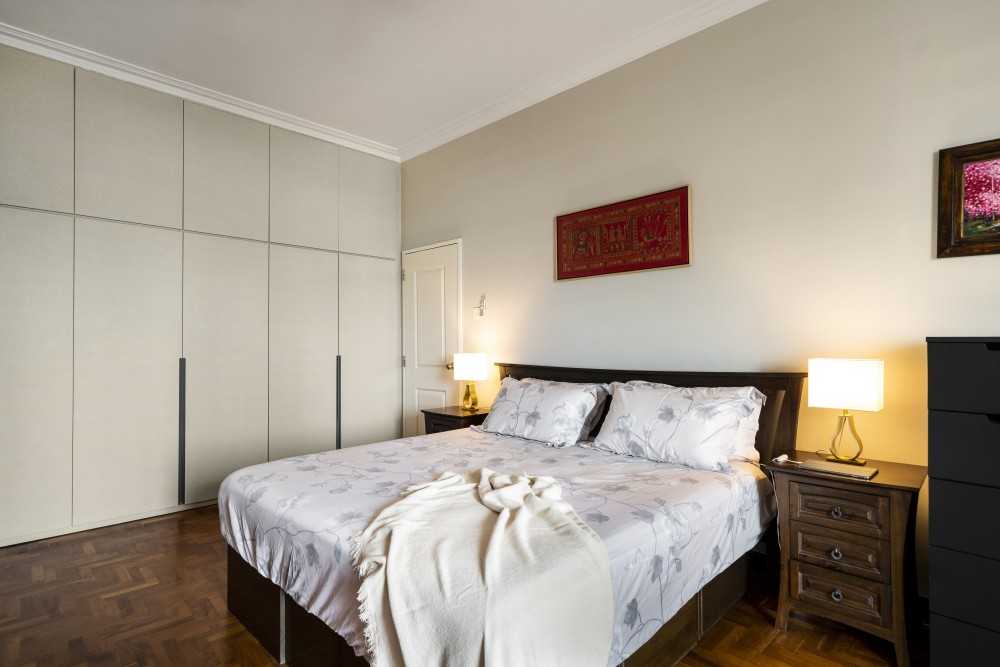 Minimalist Bedroom with Platform Bed and Parquet Floor
