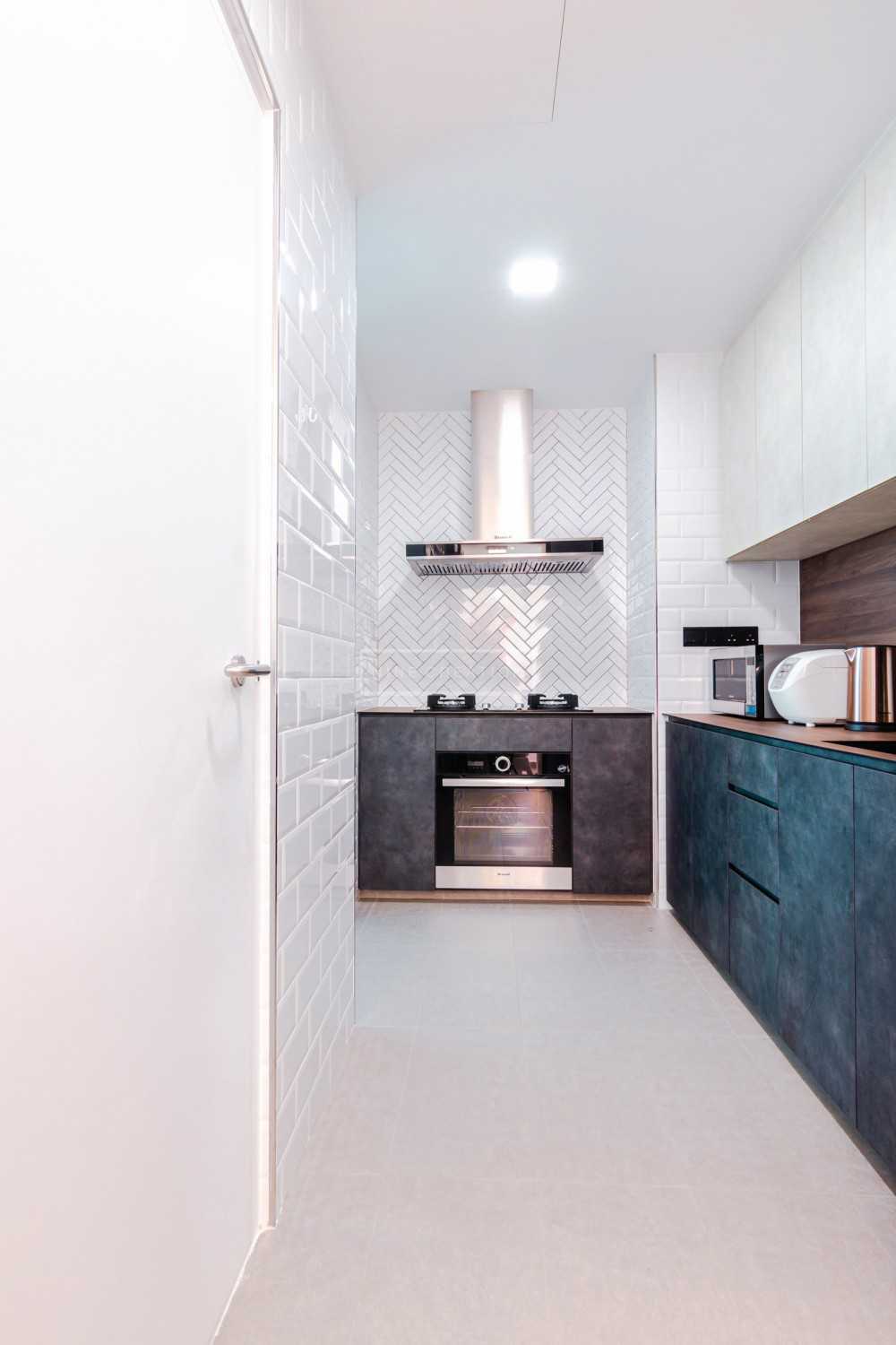Industrial Kitchen with Countertop and Herringbone Tiling