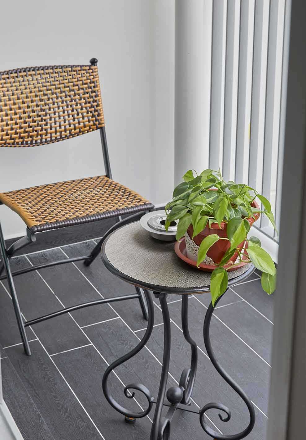 Vintage Balcony with Bay Window and Outdoor Table