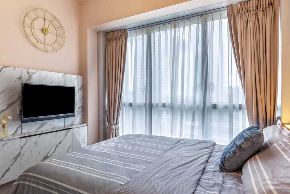 Modern Bedroom with TV Console and Queen Bed
