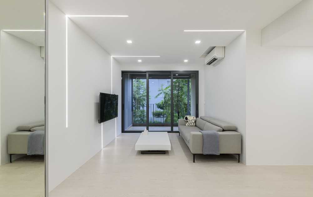 Modern Living Room with Vinyl Flooring and Feature Wall