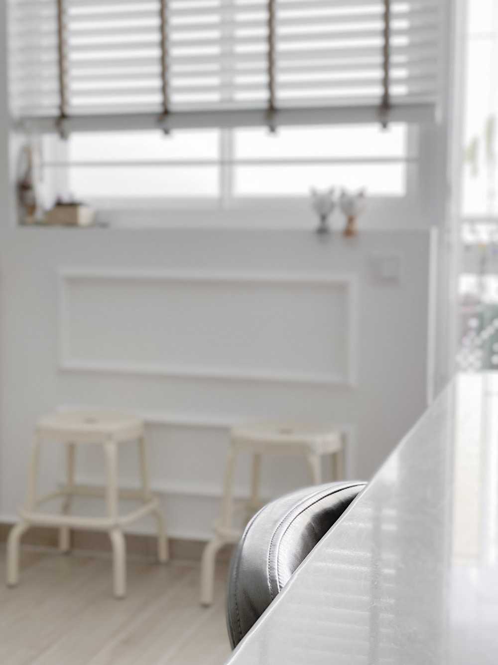 Minimalist Dining Room with Kitchen Window and Dining Table