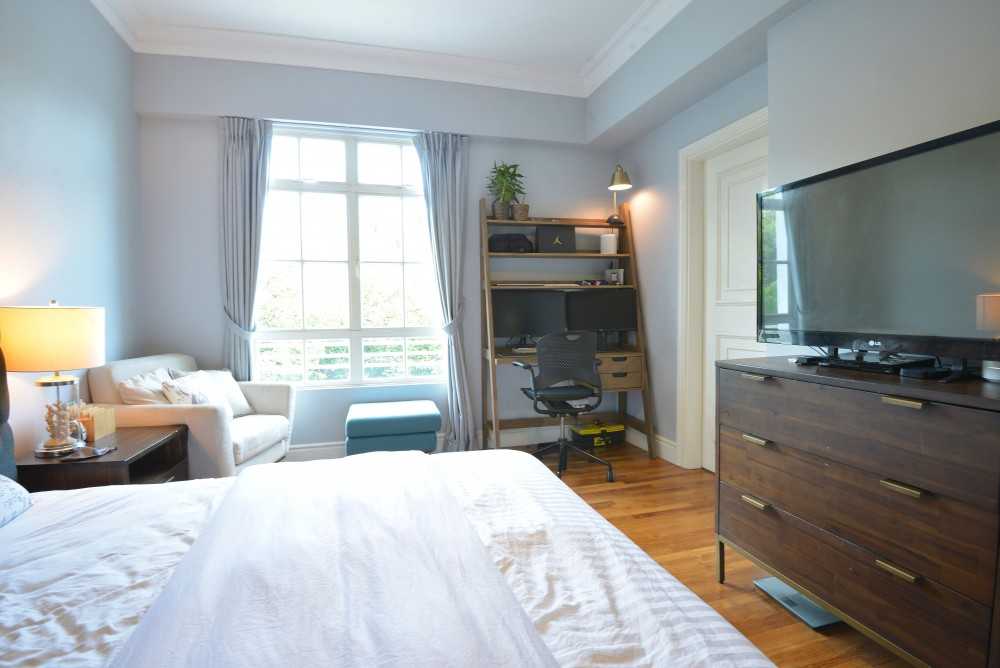 Modern Bedroom with Bookshelf and Vinyl Flooring