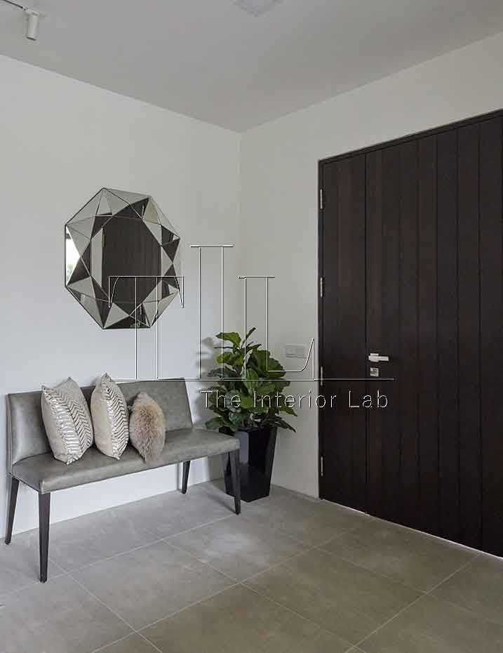 Contemporary Foyer with Homogeneous Tiles and Mirror