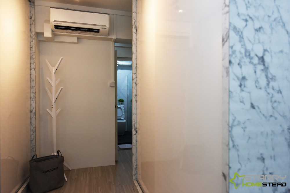 Scandinavian Entryway with Storage Cabinets and Coat Rack