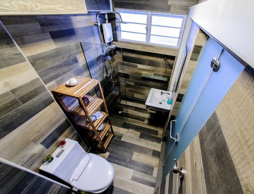 Eclectic Bathroom with Homogeneous Tiles and Wood Flooring