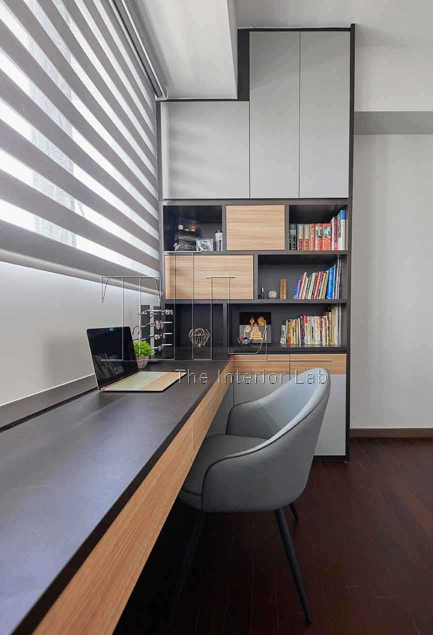 Contemporary Home Office with Bookshelf and Desk Chairs