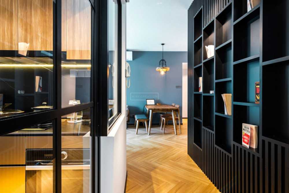 Contemporary Hallway with Bookshelf and Artwork