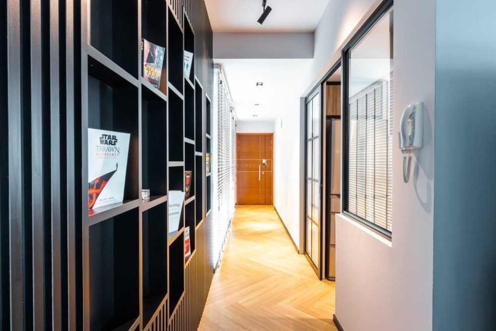 Contemporary Hallway with Bookshelf and Artwork