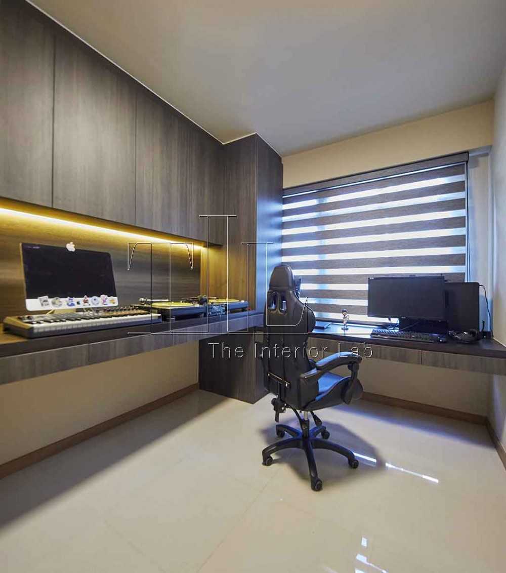 Contemporary Studio with Cove Lighting and Storage Cabinets